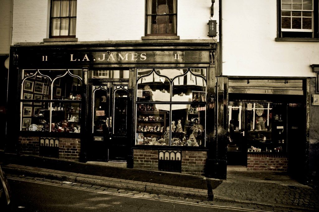 Daytime view of the L. A. James of St Albans shopfront and window displays
