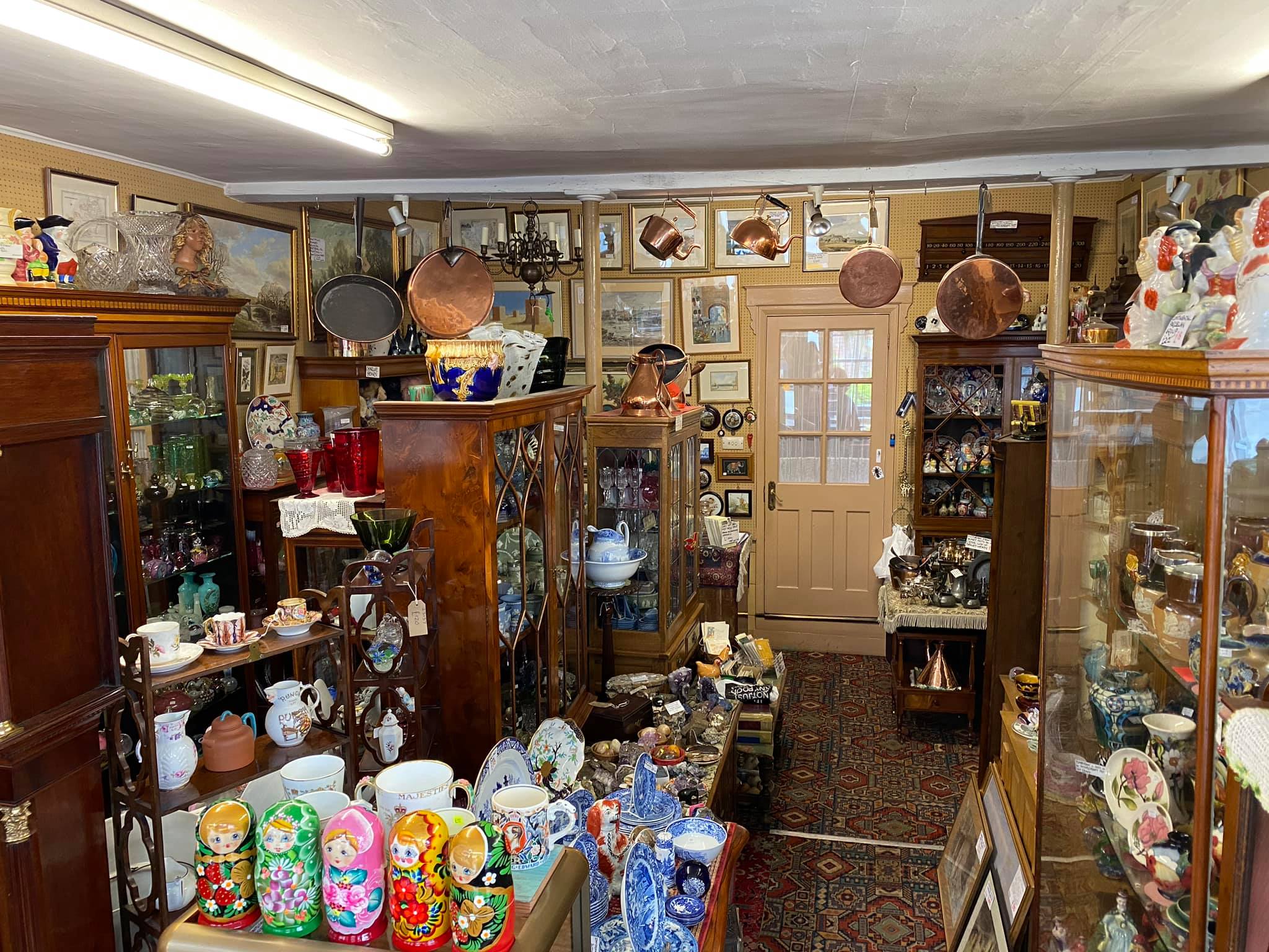 Inside the shop, packed with antique furniture, china and copperware